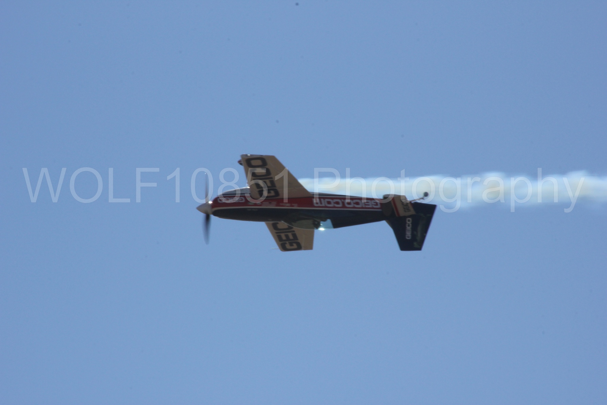 Aviation photography by WOLF10851 featuring Tim Weber, Geico, GEICO Skytypers, Extra EA-300, California Capital Airshow 2012.