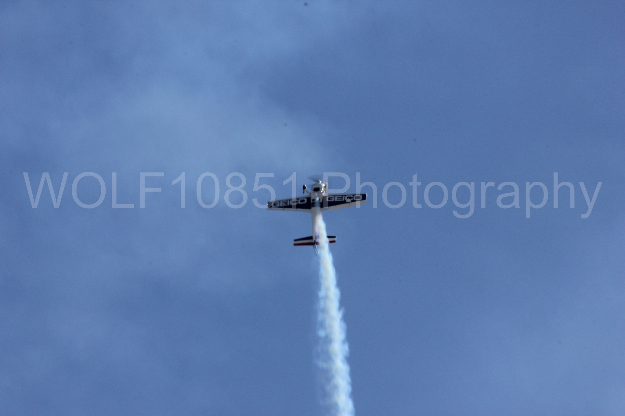 Aviation photography by WOLF10851 featuring Tim Weber, Geico, GEICO Skytypers, Extra EA-300, California Capital Airshow 2012.