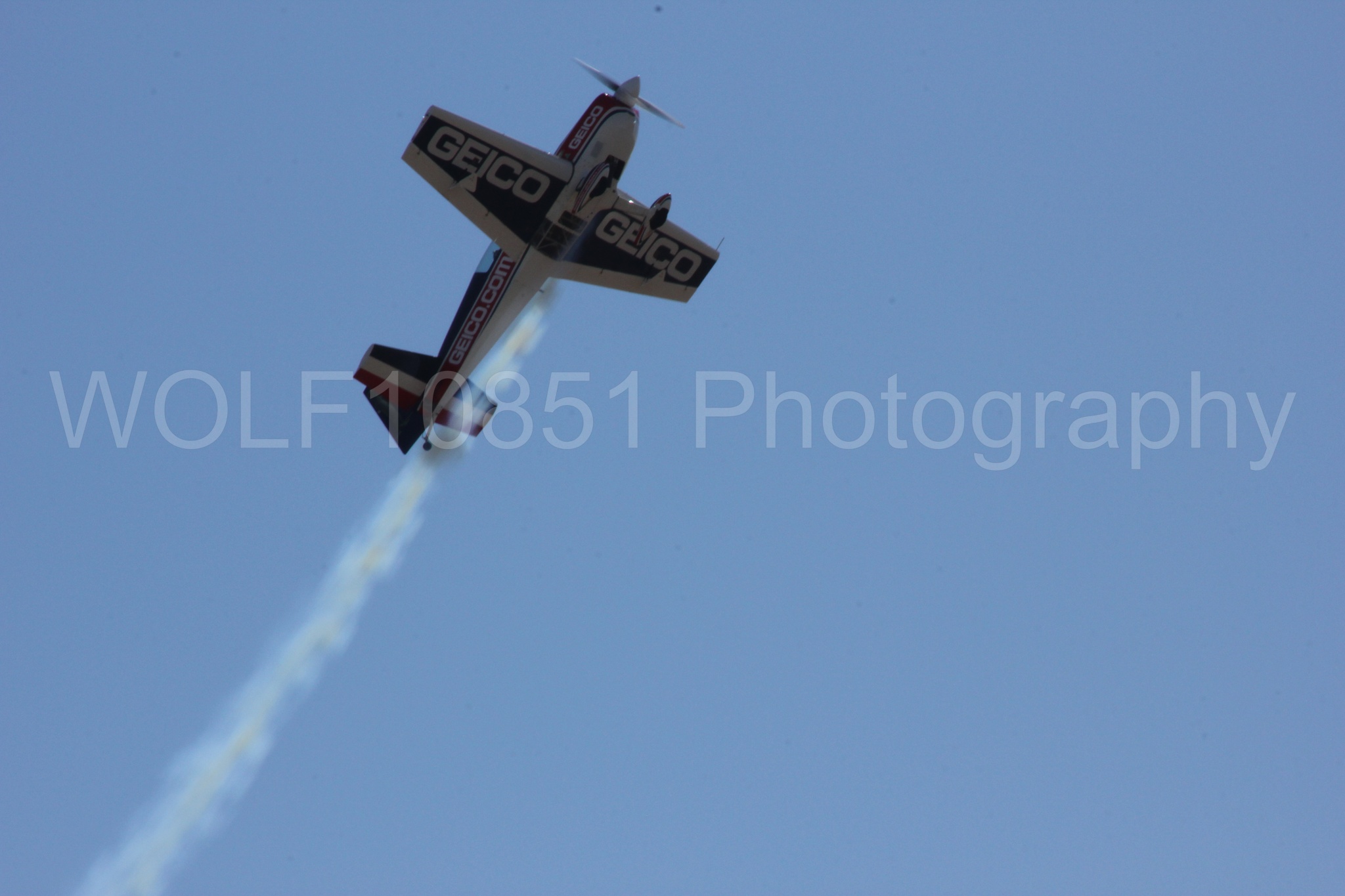 Aviation photography by WOLF10851 featuring Tim Weber, Geico, GEICO Skytypers, Extra EA-300, California Capital Airshow 2012.