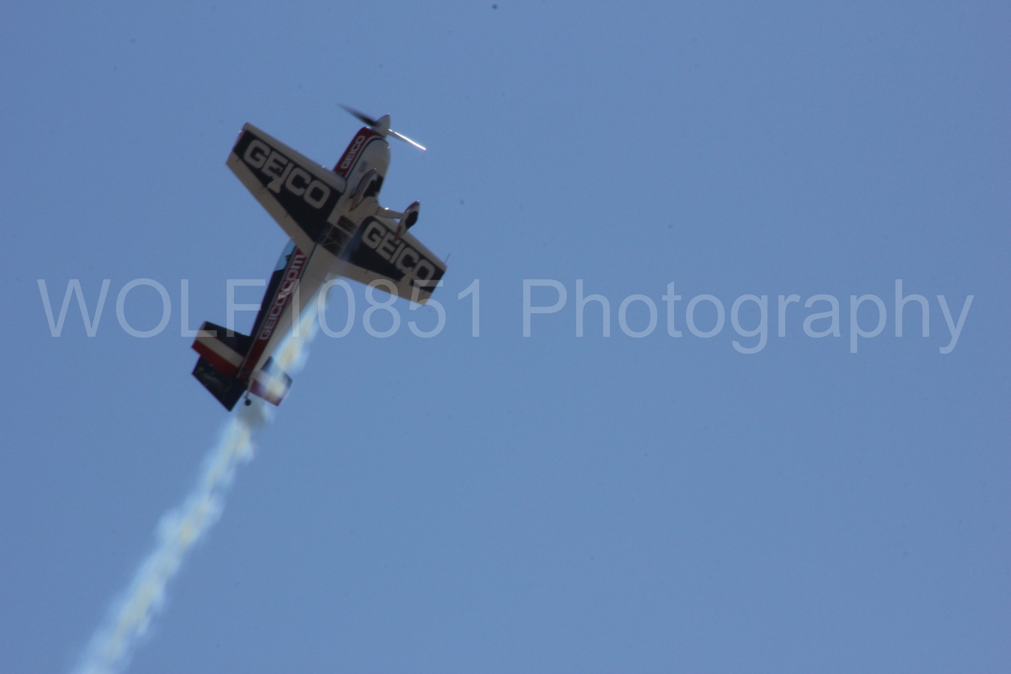 Aviation photography by WOLF10851 featuring Tim Weber, Geico, GEICO Skytypers, Extra EA-300, California Capital Airshow 2012.