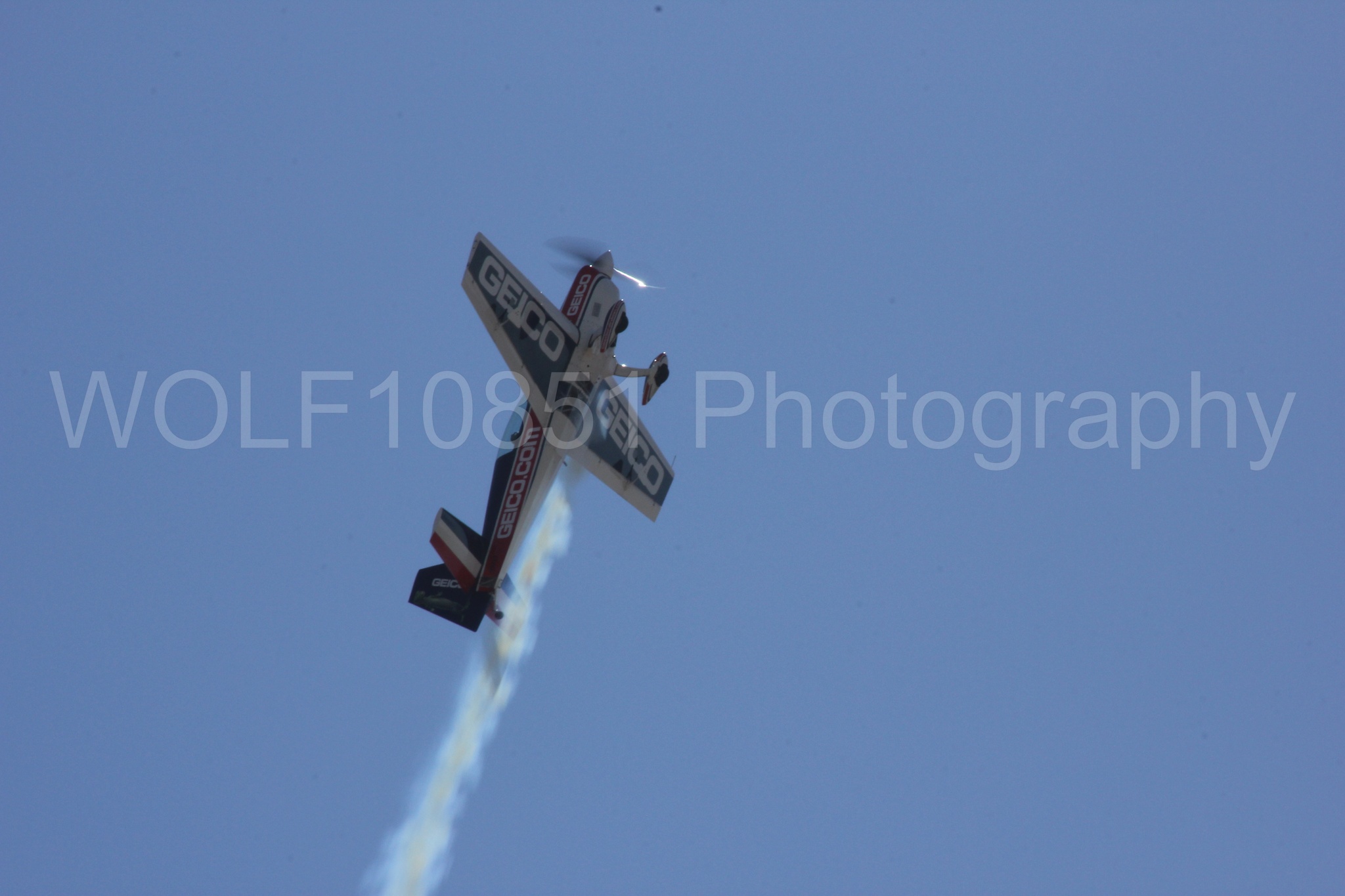 Aviation photography by WOLF10851 featuring Tim Weber, Geico, GEICO Skytypers, Extra EA-300, California Capital Airshow 2012.