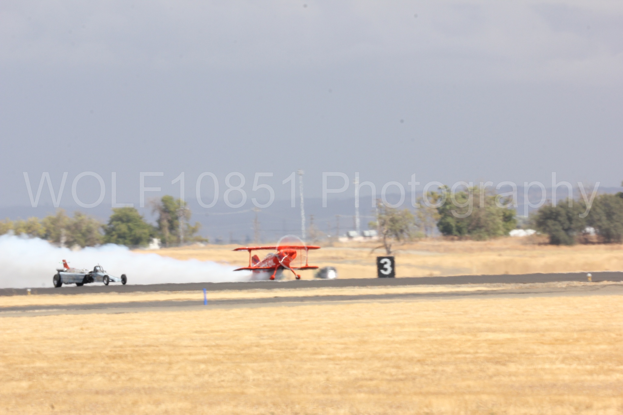 Aviation photography by WOLF10851 featuring Pitts S1-11b, Smoke N Thunder Jet Car, Smoke N Thunder, California Capital Airshow 2016, Mike Wiskus.