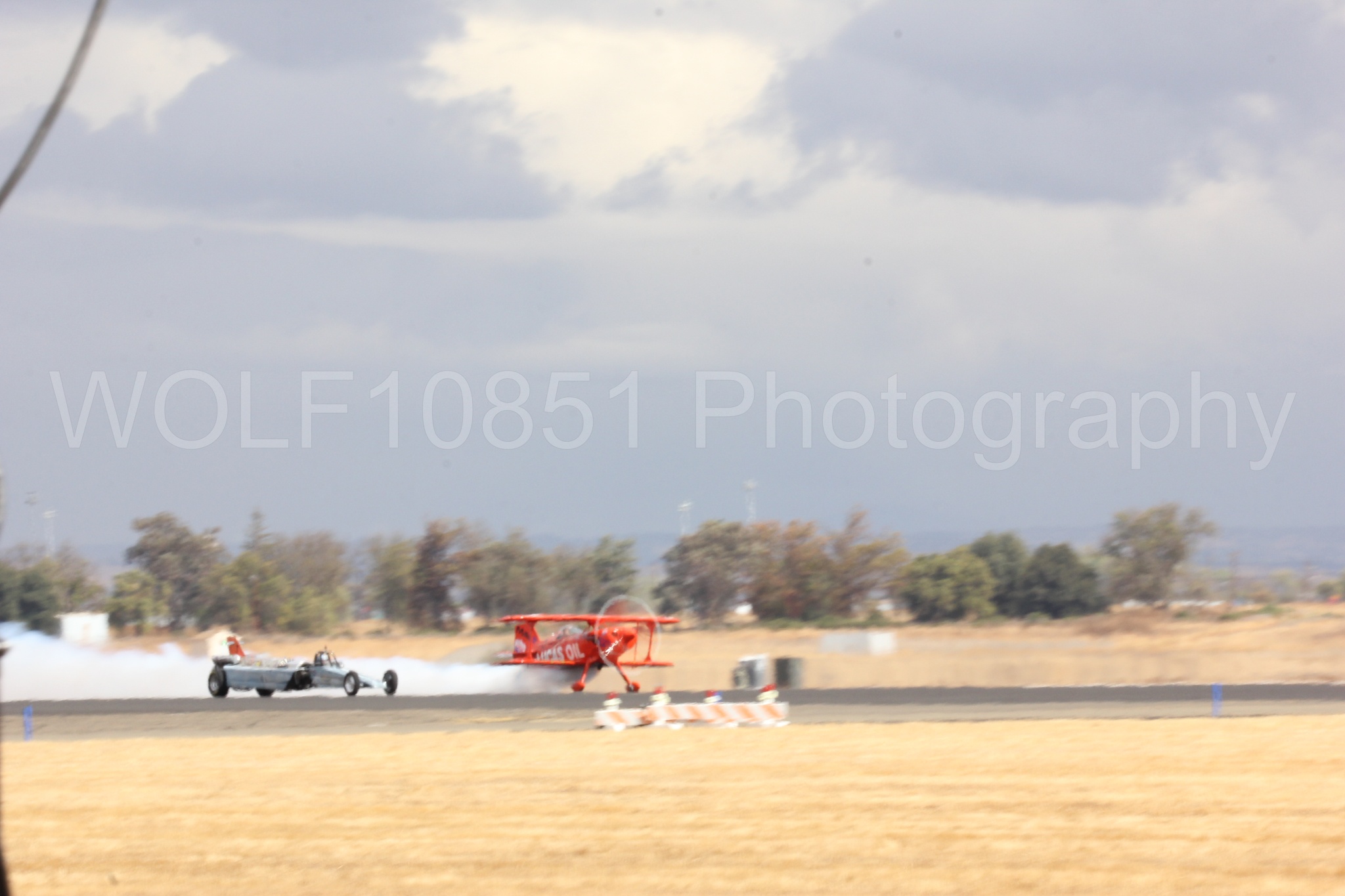 Aviation photography by WOLF10851 featuring Pitts S1-11b, Smoke N Thunder Jet Car, Smoke N Thunder, California Capital Airshow 2016, Mike Wiskus.