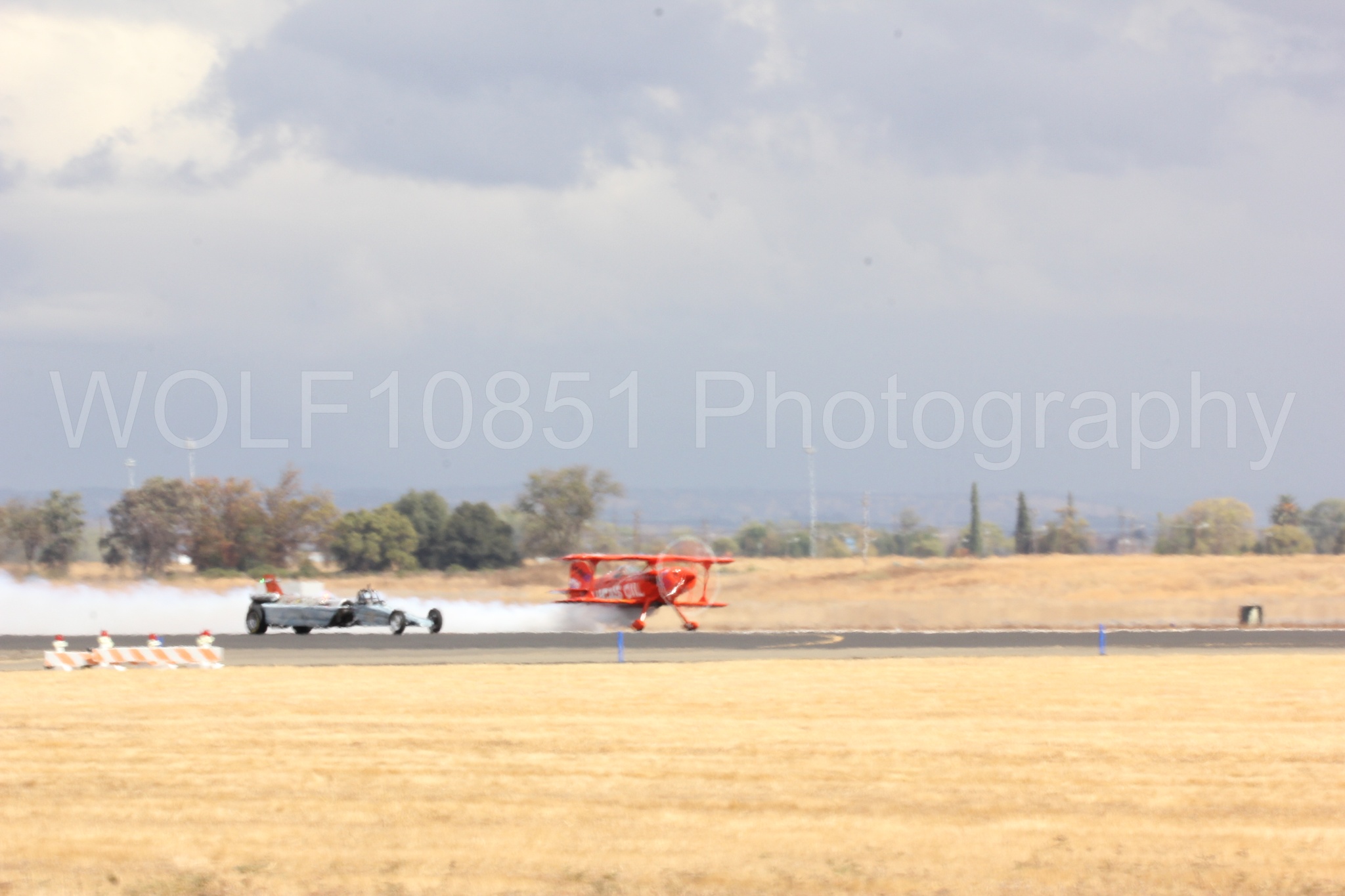 Aviation photography by WOLF10851 featuring Pitts S1-11b, Smoke N Thunder Jet Car, Smoke N Thunder, California Capital Airshow 2016, Mike Wiskus.