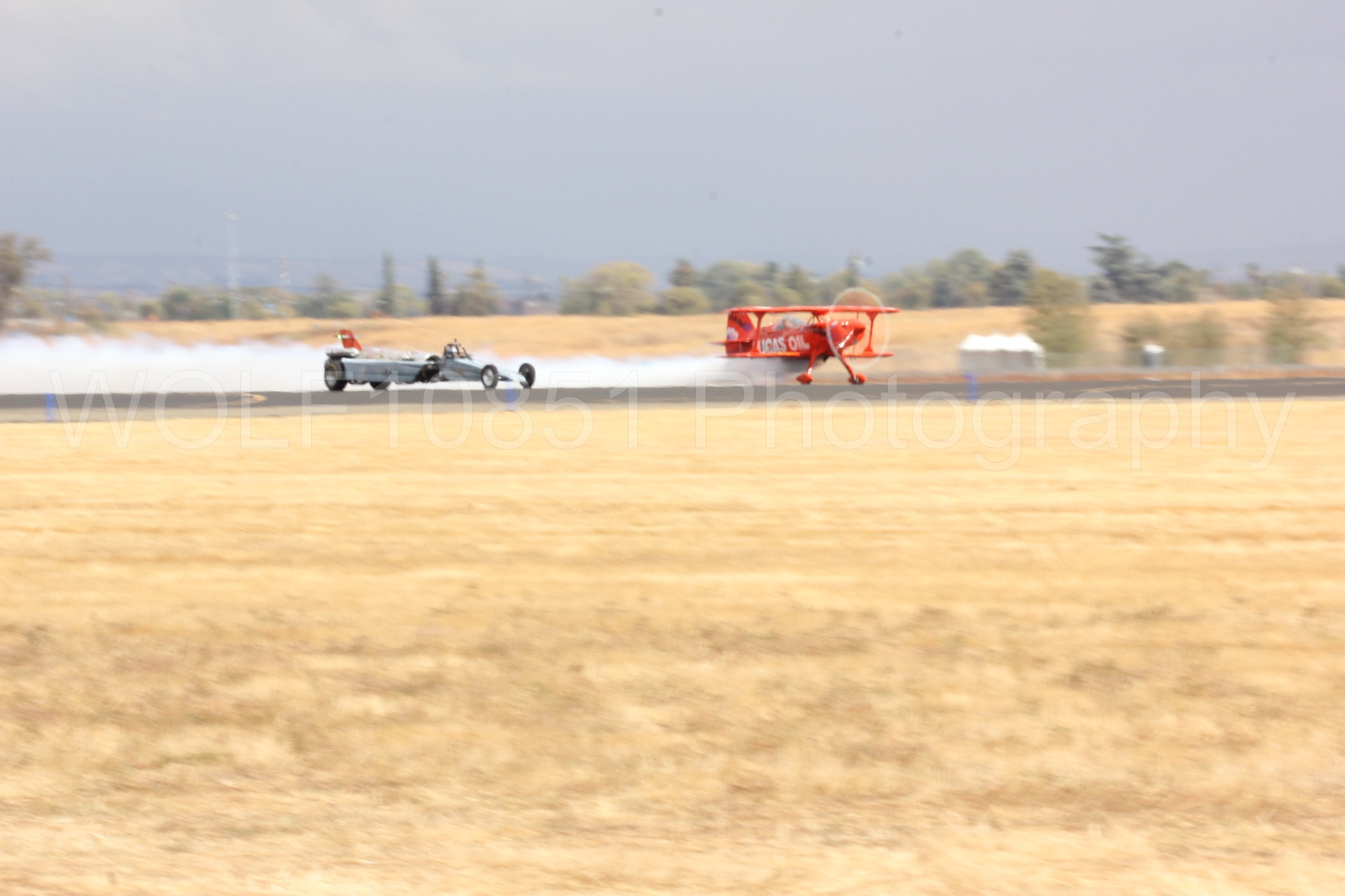 Aviation photography by WOLF10851 featuring Pitts S1-11b, Smoke N Thunder Jet Car, Smoke N Thunder, California Capital Airshow 2016, Mike Wiskus.