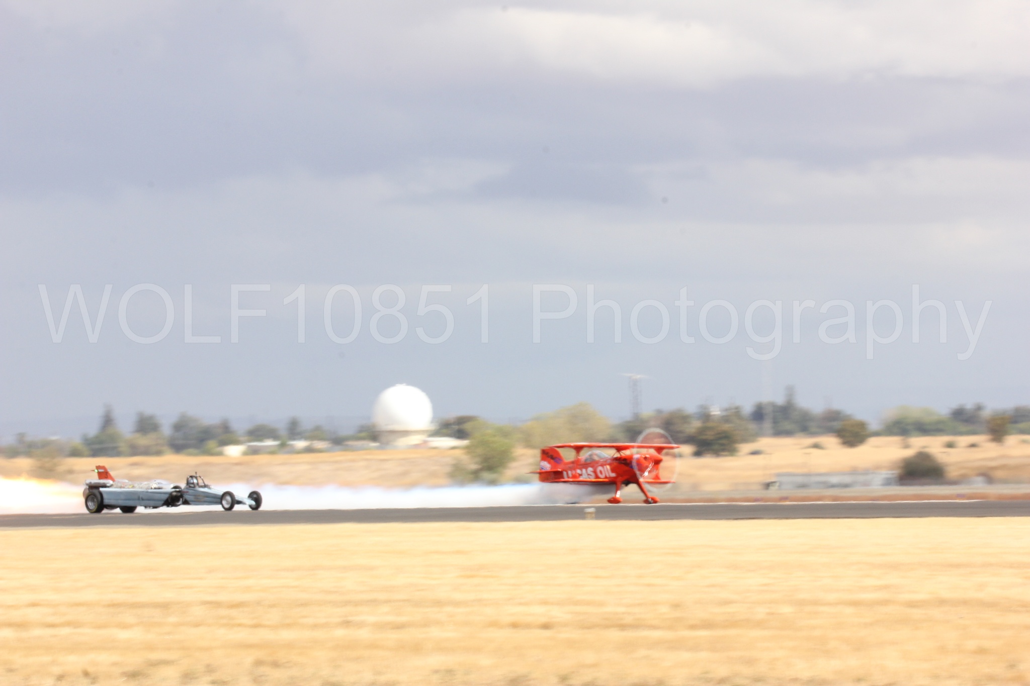 Aviation photography by WOLF10851 featuring Pitts S1-11b, Smoke N Thunder Jet Car, Smoke N Thunder, California Capital Airshow 2016, Mike Wiskus.