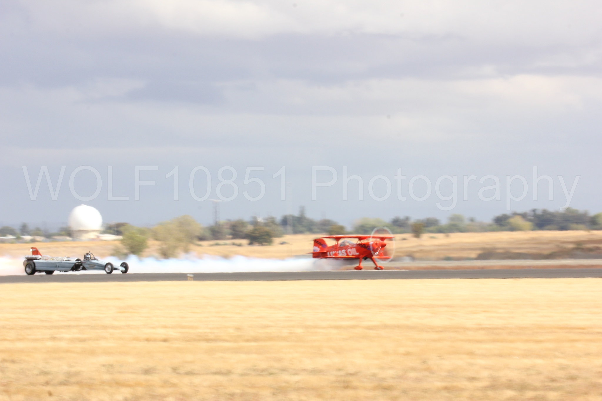 Aviation photography by WOLF10851 featuring Pitts S1-11b, Smoke N Thunder Jet Car, Smoke N Thunder, California Capital Airshow 2016, Mike Wiskus.