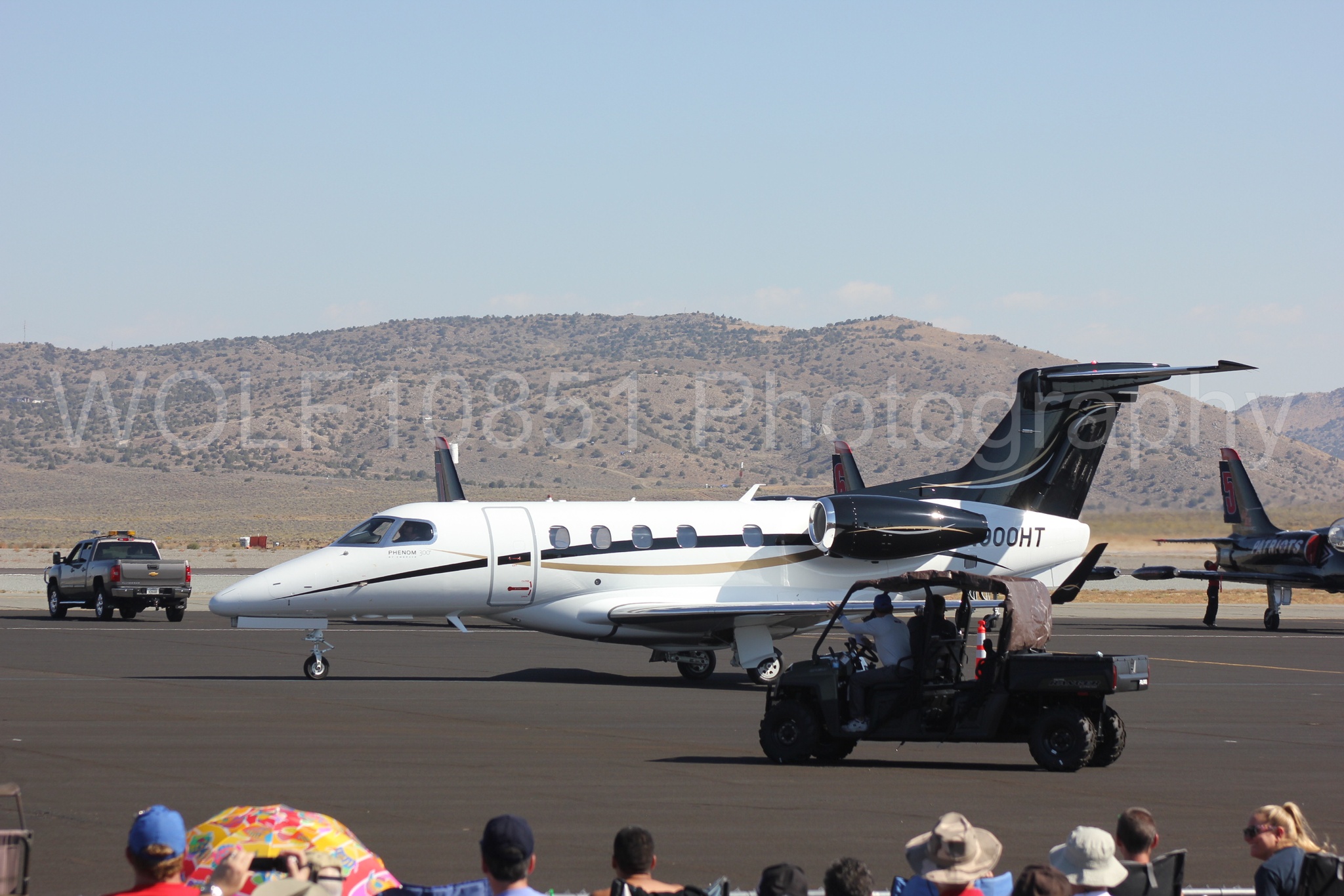 Aviation photography by WOLF10851 featuring Reno Air Races 2013, Embraer Phenom 300.